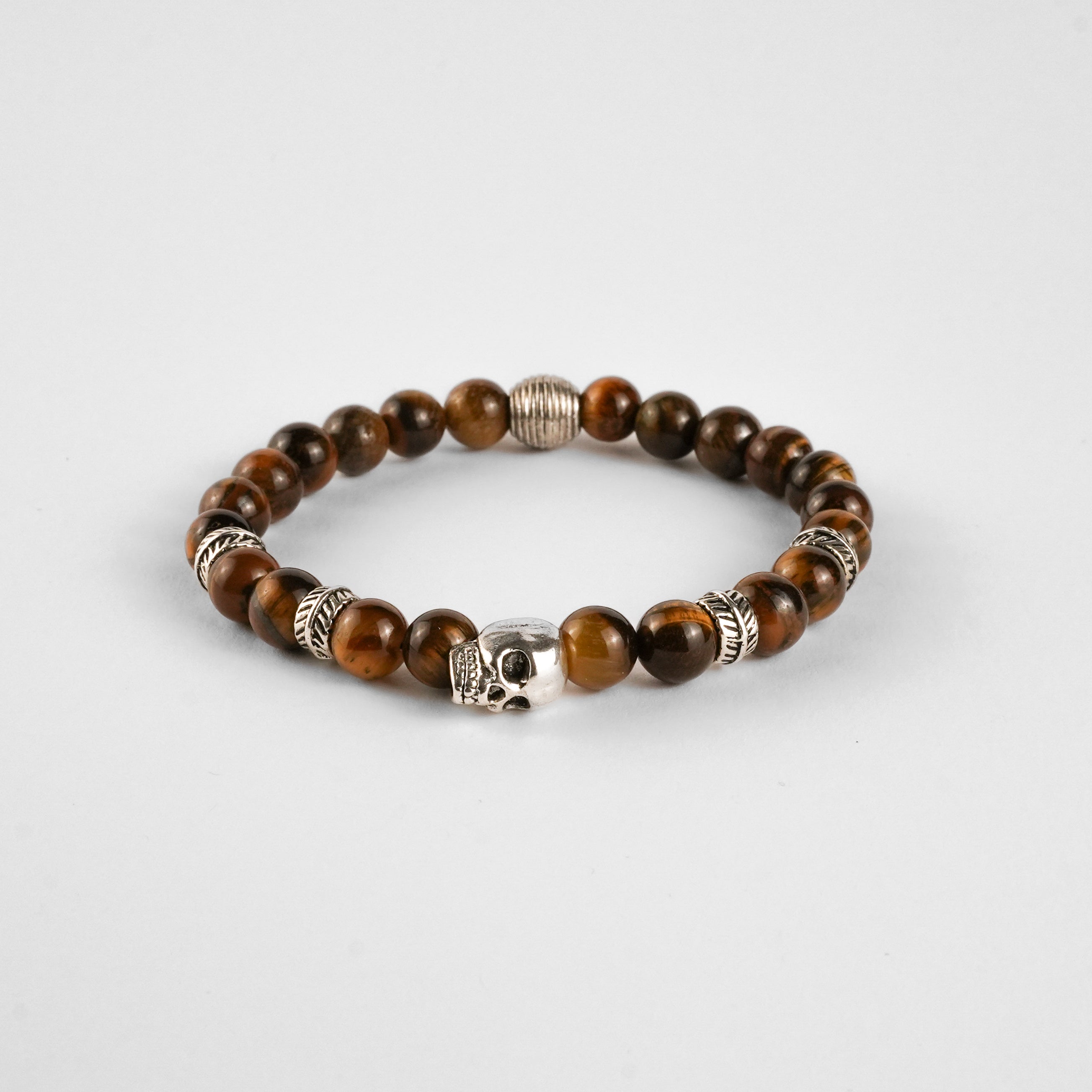 Pulsera de Ojo de Tigre con Calavera — Energía, Protección y Estilo Rebelde
